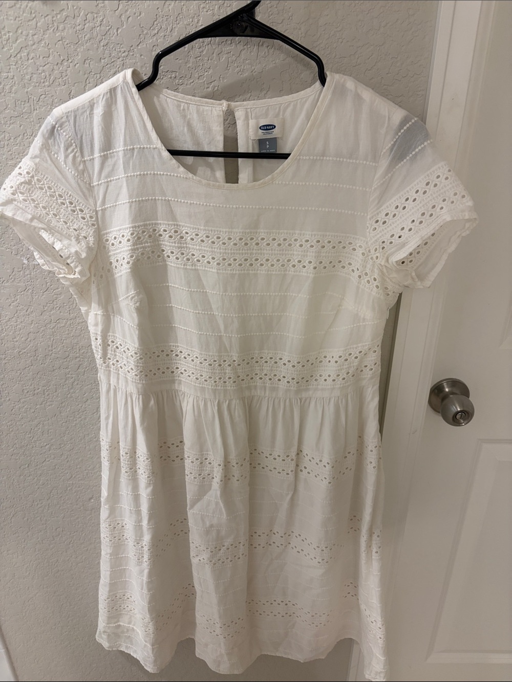 Dress-like white top with eyelet details